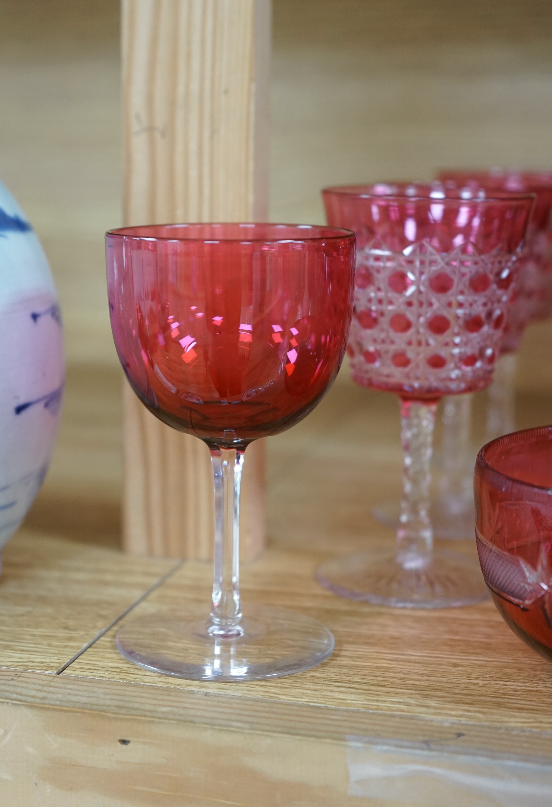 Two cranberry glass liqueur decanters and a collection of various glasses and a bowl, decanters 25cm high. Condition - good
